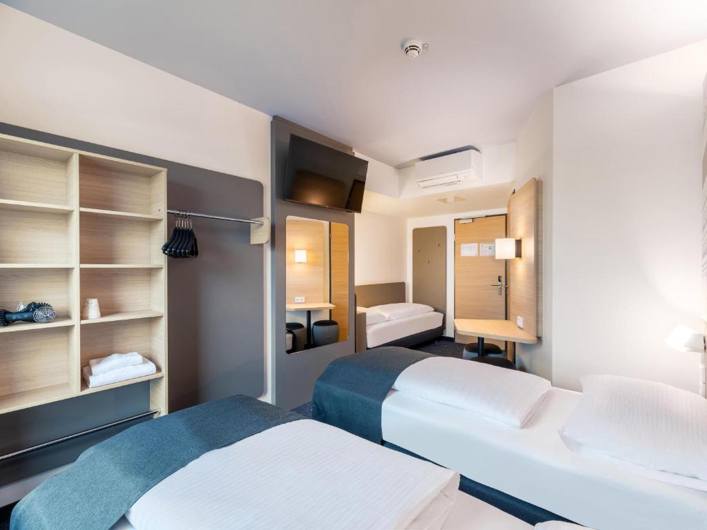 Postel nebo postele na pokoji v ubytování B&B HOTEL St-Pölten