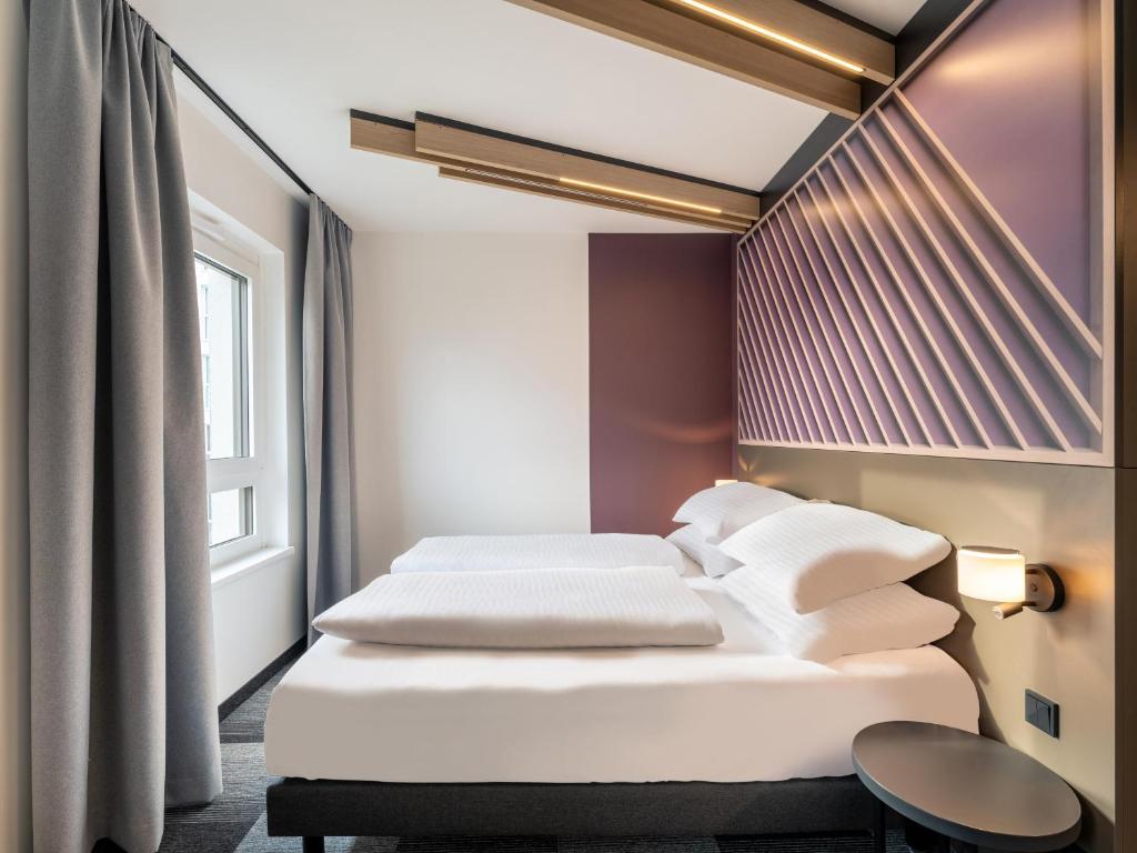 Postel nebo postele na pokoji v ubytování B&B HOTEL St-Pölten