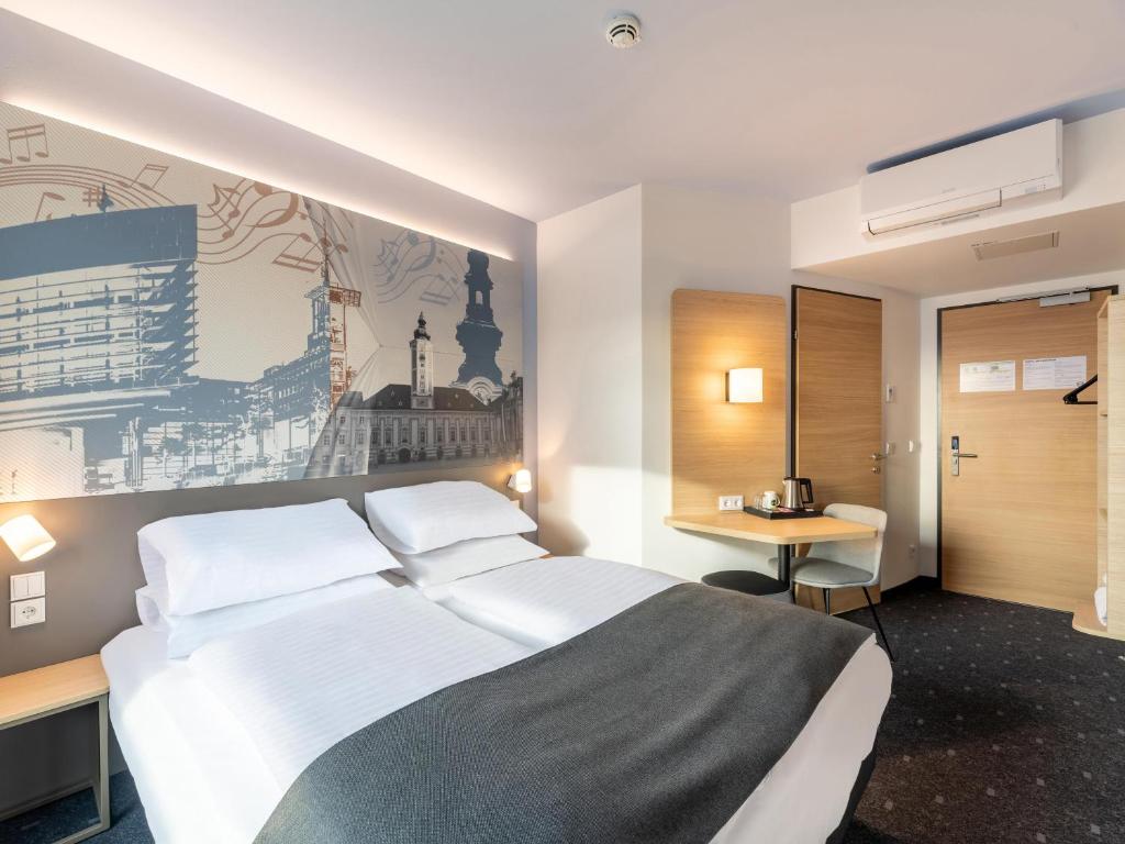 Postel nebo postele na pokoji v ubytování B&B HOTEL St-Pölten