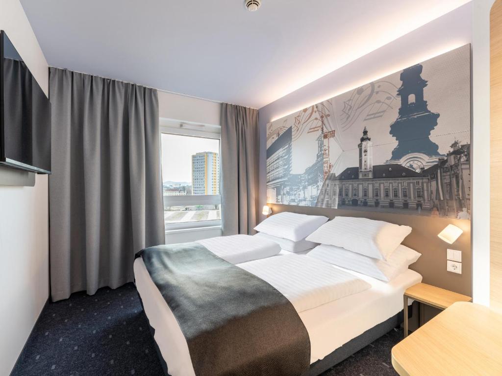 Postel nebo postele na pokoji v ubytování B&B HOTEL St-Pölten