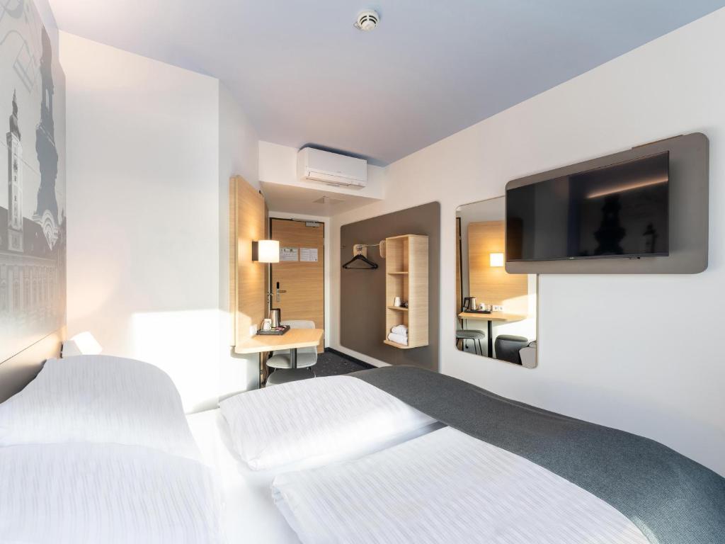 Postel nebo postele na pokoji v ubytování B&B HOTEL St-Pölten