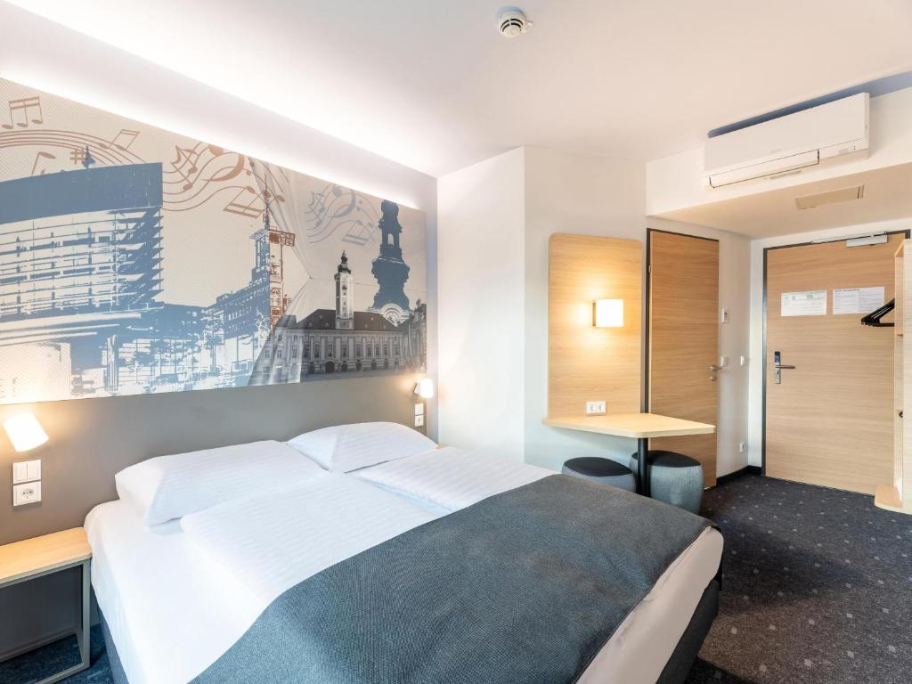 Postel nebo postele na pokoji v ubytování B&B HOTEL St-Pölten