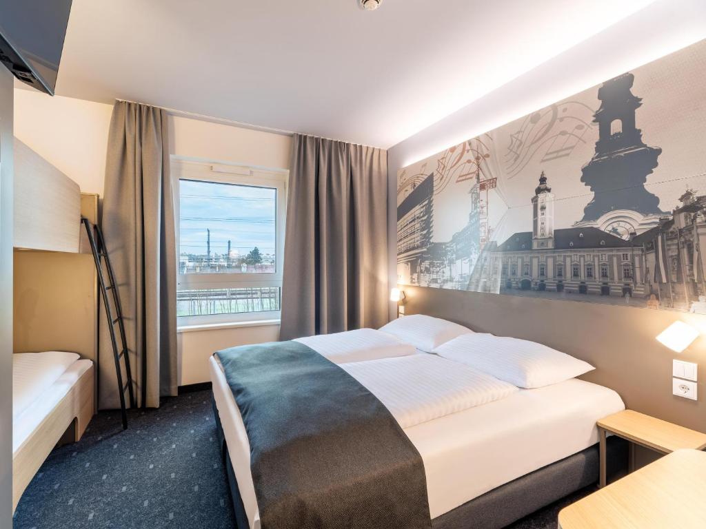 Postel nebo postele na pokoji v ubytování B&B HOTEL St-Pölten