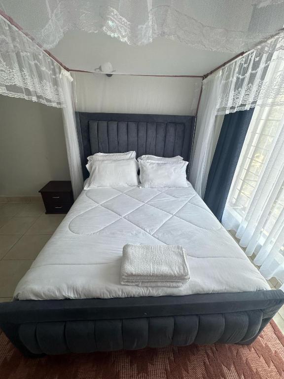 Postel nebo postele na pokoji v ubytování Ecostay condo