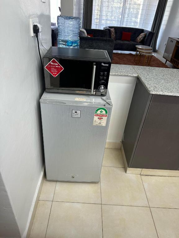 Kuchyň nebo kuchyňský kout v ubytování Ecostay condo
