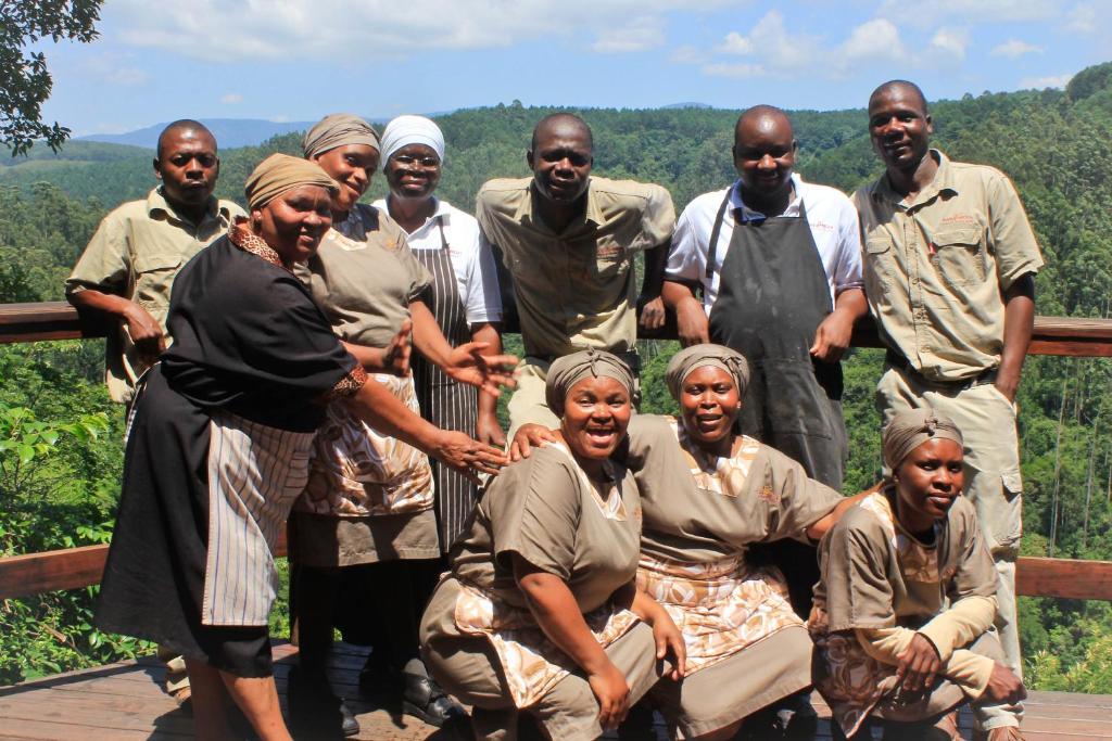 a large group of people posing for a picture at Tanamera Lodge in Hazyview
