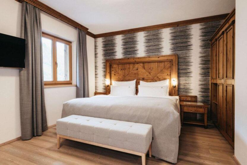 Postel nebo postele na pokoji v ubytování Hotel Oberforsthof