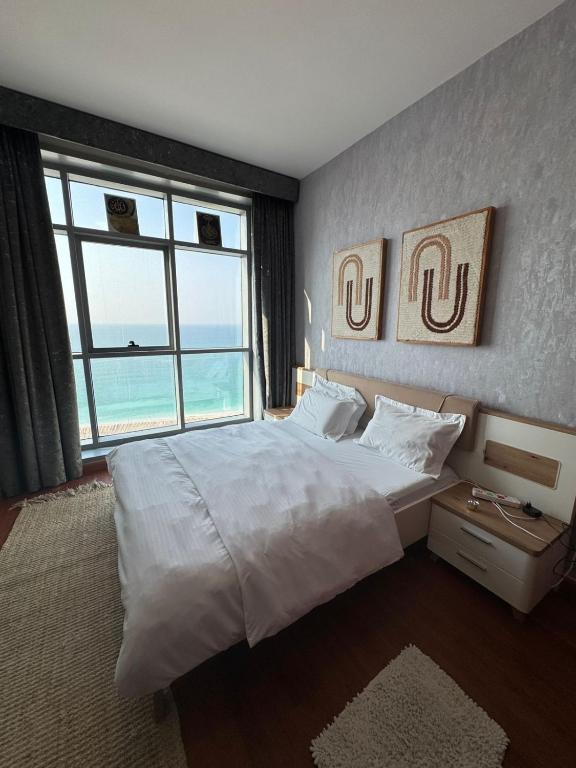 Postel nebo postele na pokoji v ubytování Blue Horizon Stays at Ajman Corniche