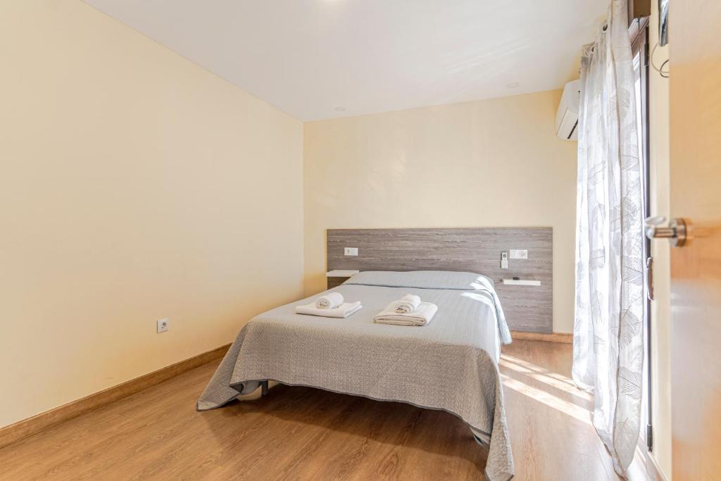 Posteľ alebo postele v izbe v ubytovaní La Casita de la Plaza