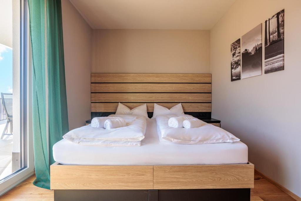 Postel nebo postele na pokoji v ubytování Adlerblick Deluxe Annenheim