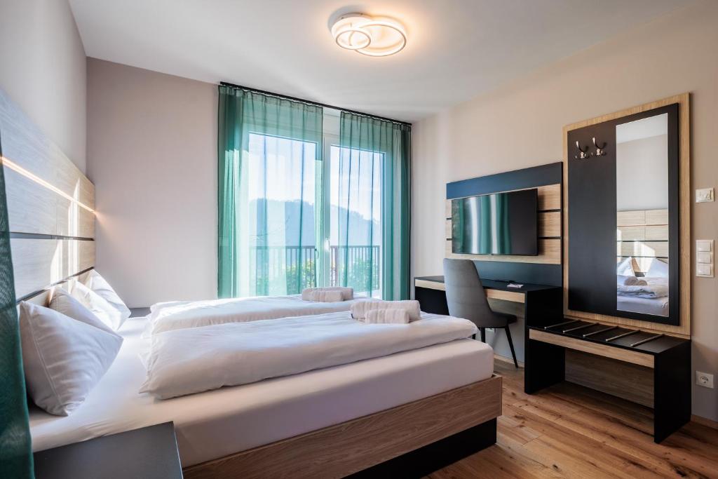 Postel nebo postele na pokoji v ubytování Adlerblick Deluxe Annenheim