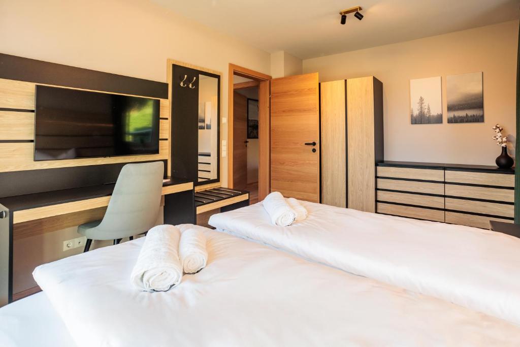 Postel nebo postele na pokoji v ubytování Adlerblick Deluxe Annenheim