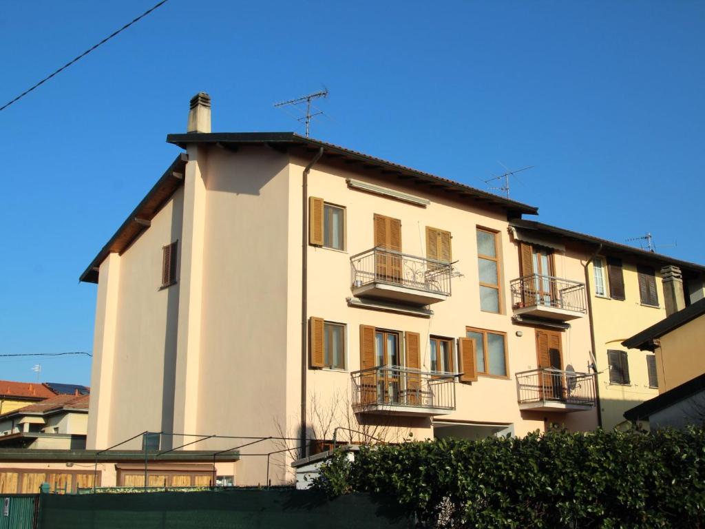 a white building with balconies on the side of it at Apartment Il Castello by Interhome in Casciago