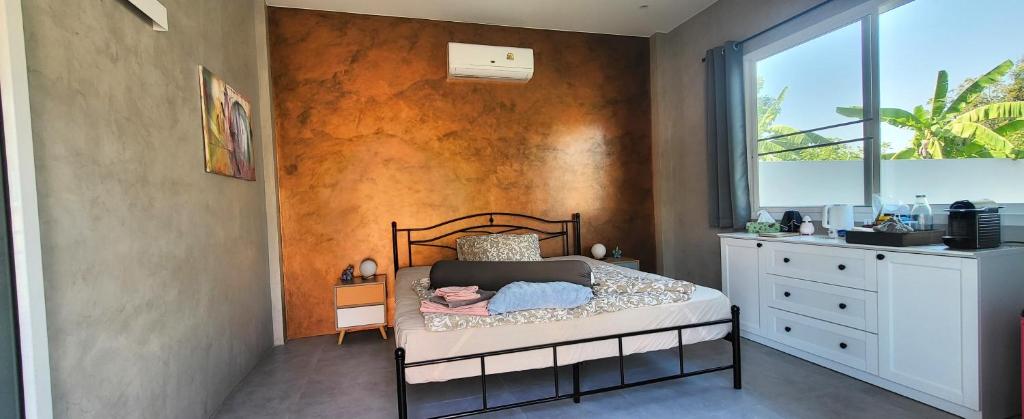 Postel nebo postele na pokoji v ubytování Sunset Homestay