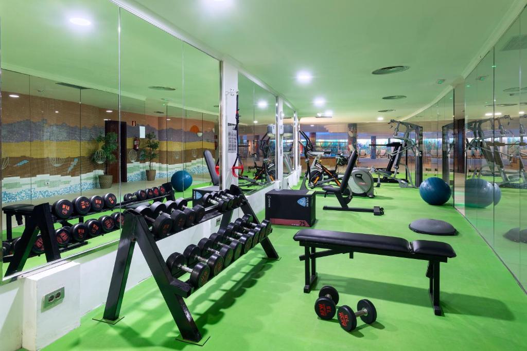 a gym with lots of treadmills and exercise equipment at MUR Faro Jandia Fuerteventura & Spa in Morro del Jable