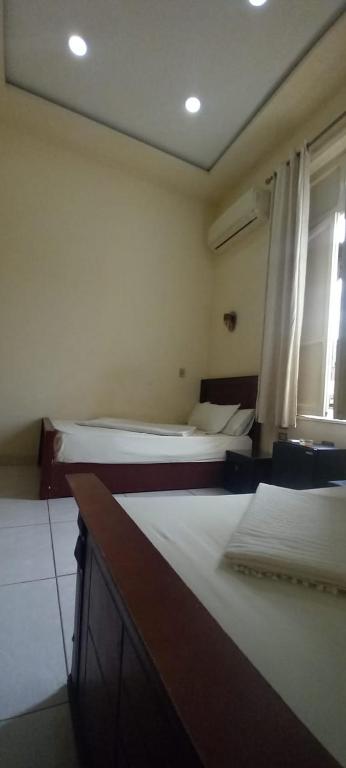 Postel nebo postele na pokoji v ubytování Five Hostel