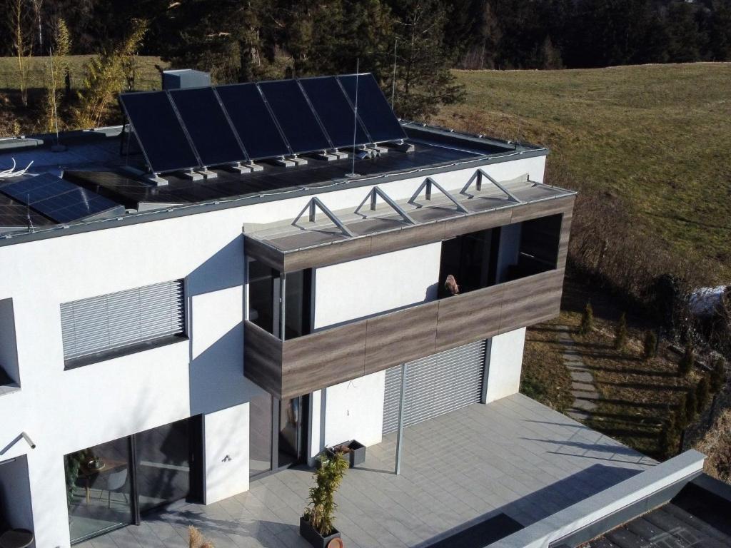 an aerial view of a house with solar panels on the roof at Apartment Wibmer by Interhome in Axams