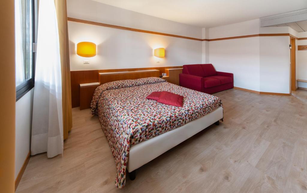 Postel nebo postele na pokoji v ubytování Bonotto Hotel Palladio