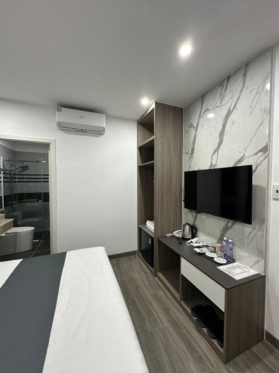TV a/nebo společenská místnost v ubytování Seven Stars Hotel & Apartment