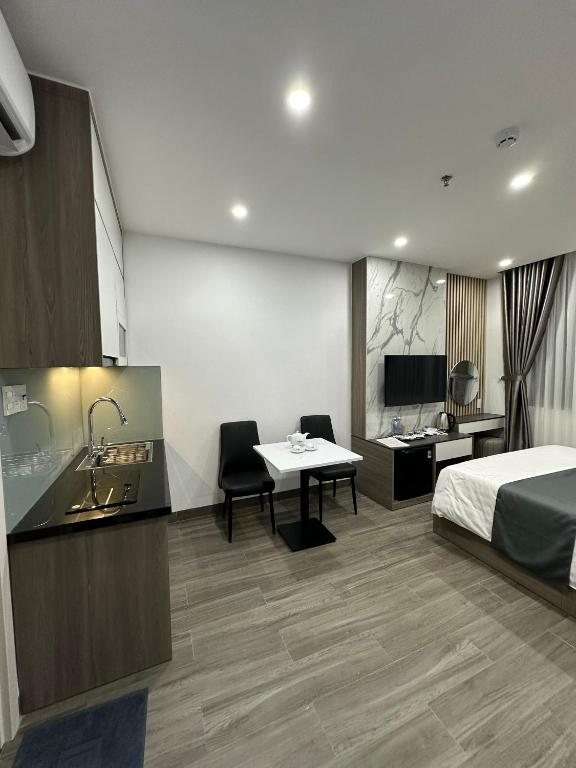 TV a/nebo společenská místnost v ubytování Seven Stars Hotel & Apartment