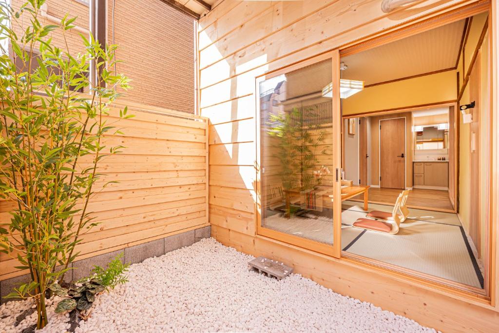 a room with a large window on the side of a house at skytree Family Hotel in Tokyo