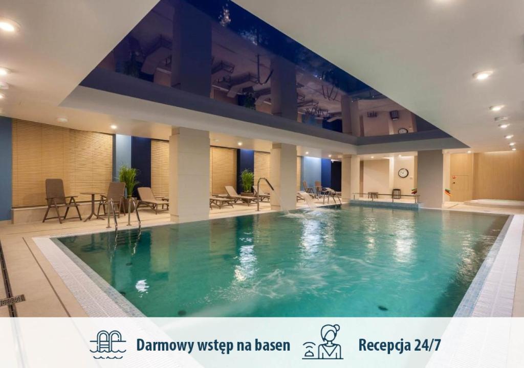 Bazén v ubytovaní GRANO APARTMENTS Gdańsk Motława SPA & Wellness alebo v jeho blízkosti