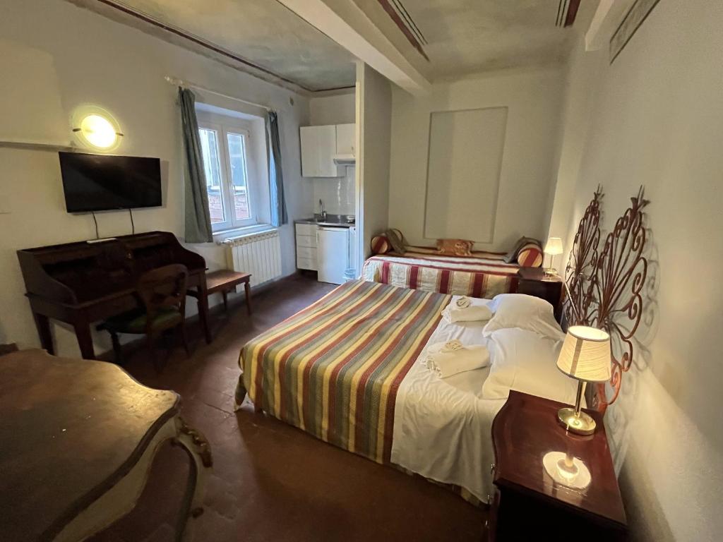Postel nebo postele na pokoji v ubytování Al Tuscany