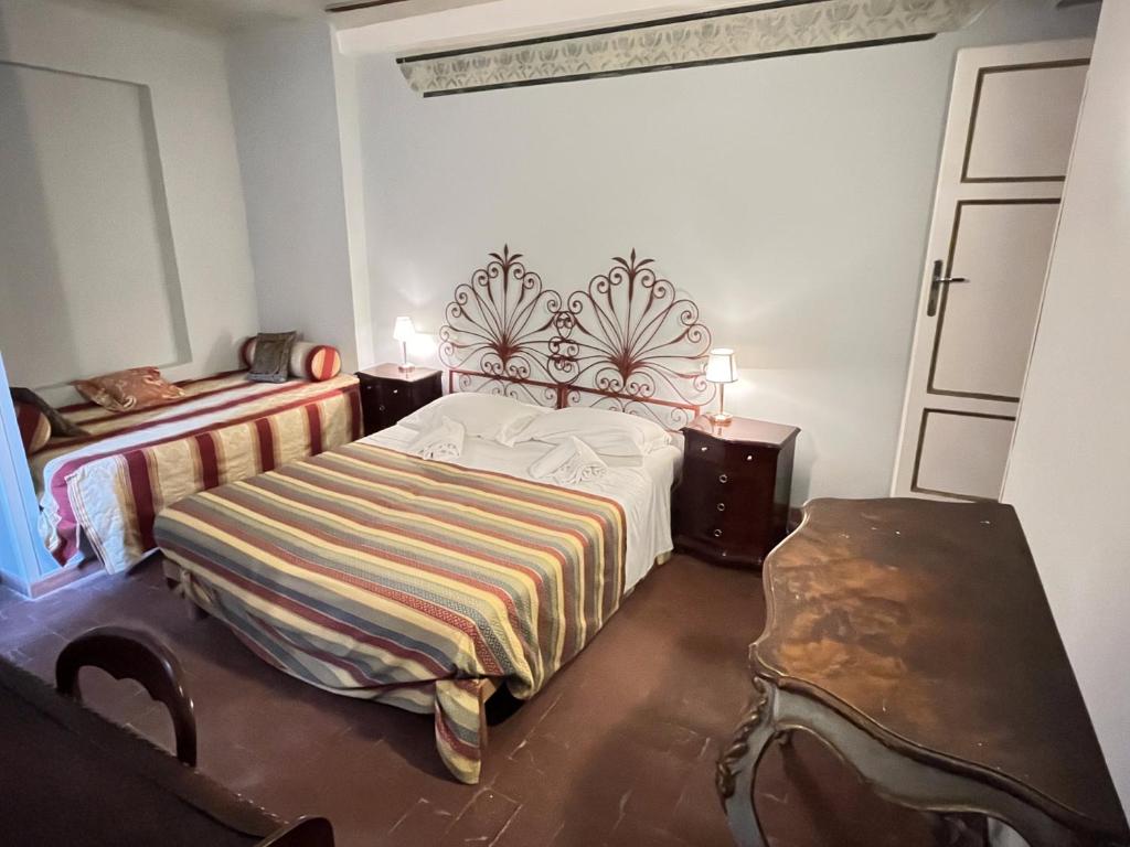 Postel nebo postele na pokoji v ubytování Al Tuscany