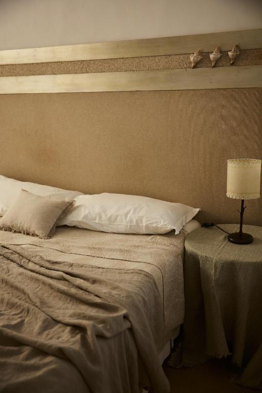 Llit o llits en una habitació de Relais Corte Palmieri & Il Chiostro - Residenza d'epoca