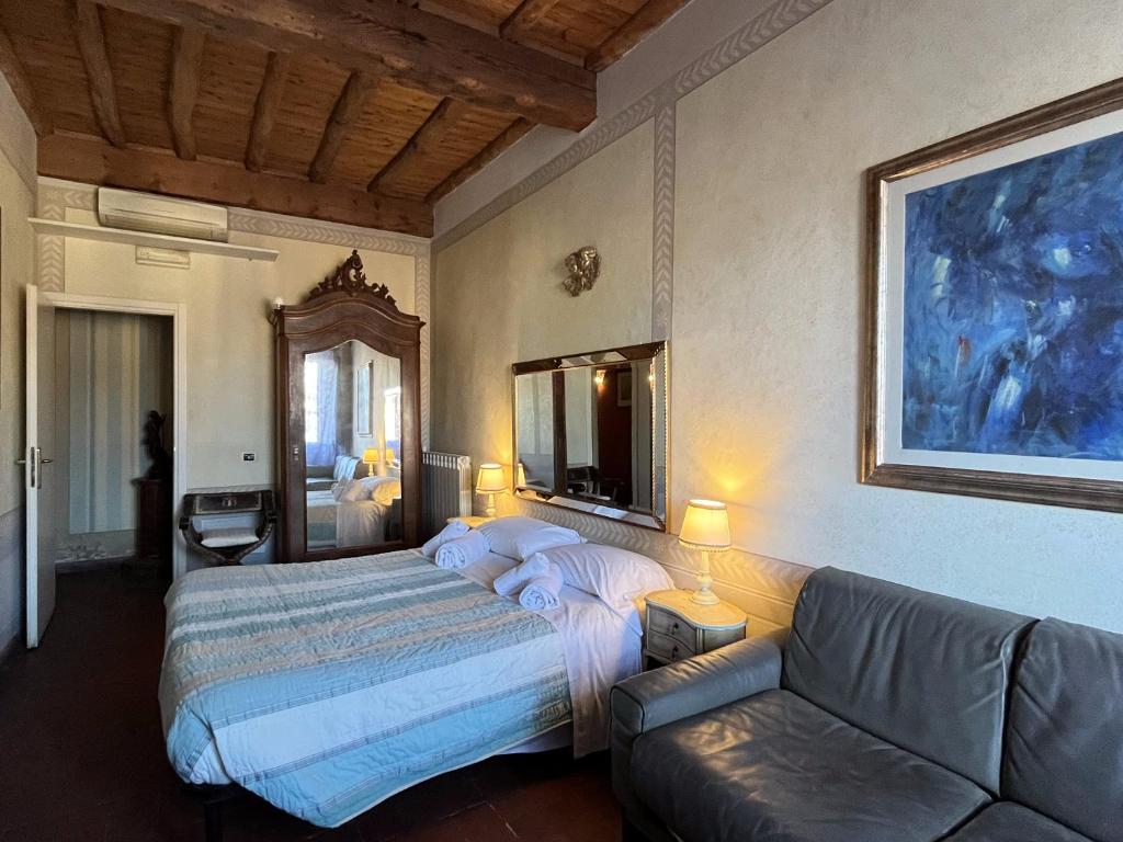 Postel nebo postele na pokoji v ubytování Al Tuscany