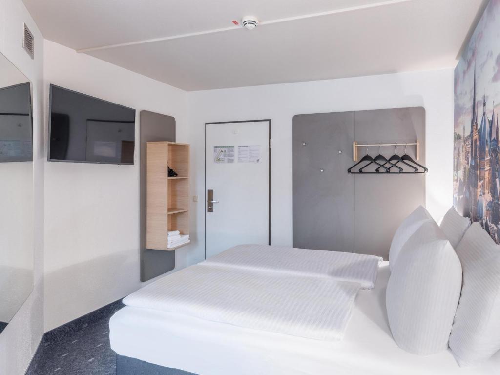 Postel nebo postele na pokoji v ubytování B&B Hotel Aachen-Hbf