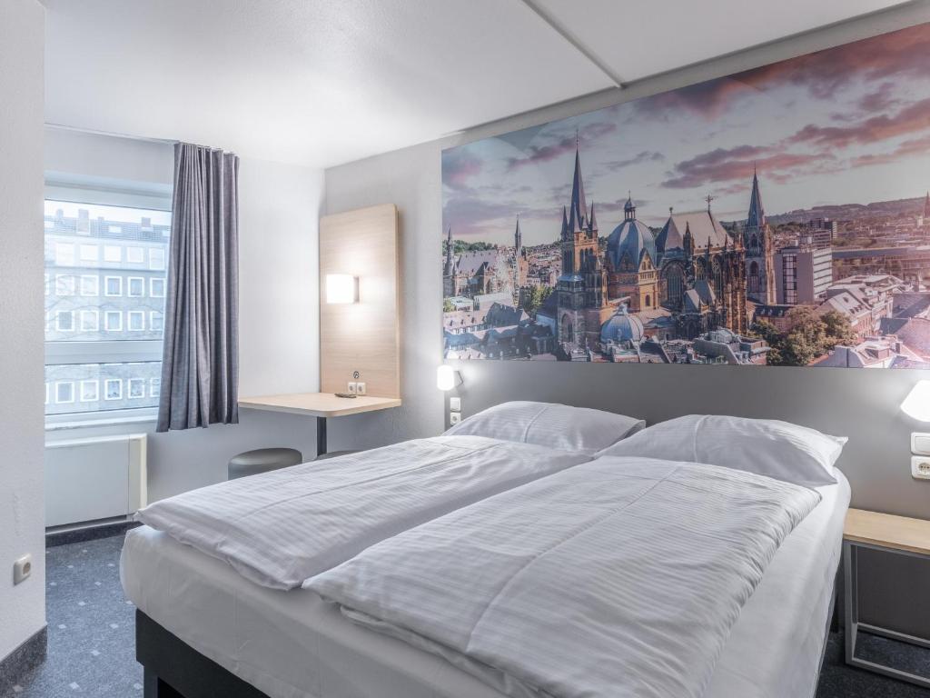 Postel nebo postele na pokoji v ubytování B&B Hotel Aachen-Hbf