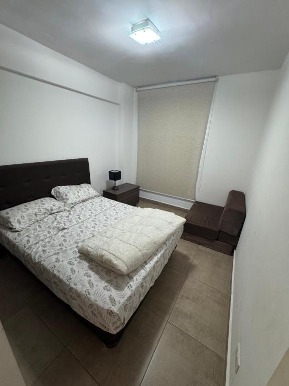 Postel nebo postele na pokoji v ubytování Edifício Wish