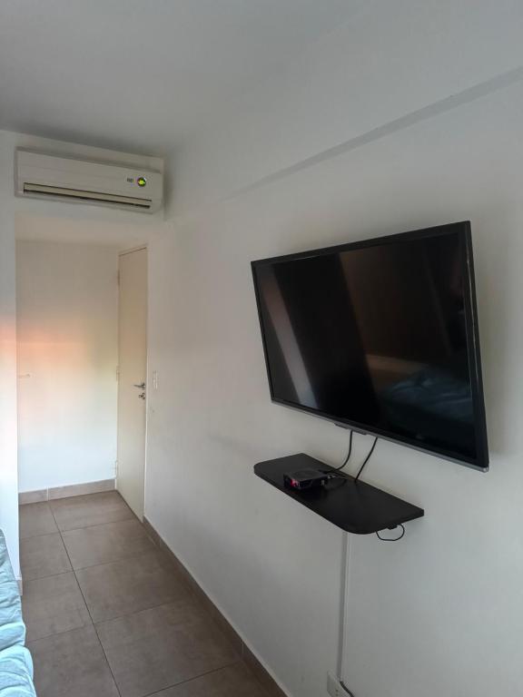 TV a/nebo společenská místnost v ubytování Edifício Wish