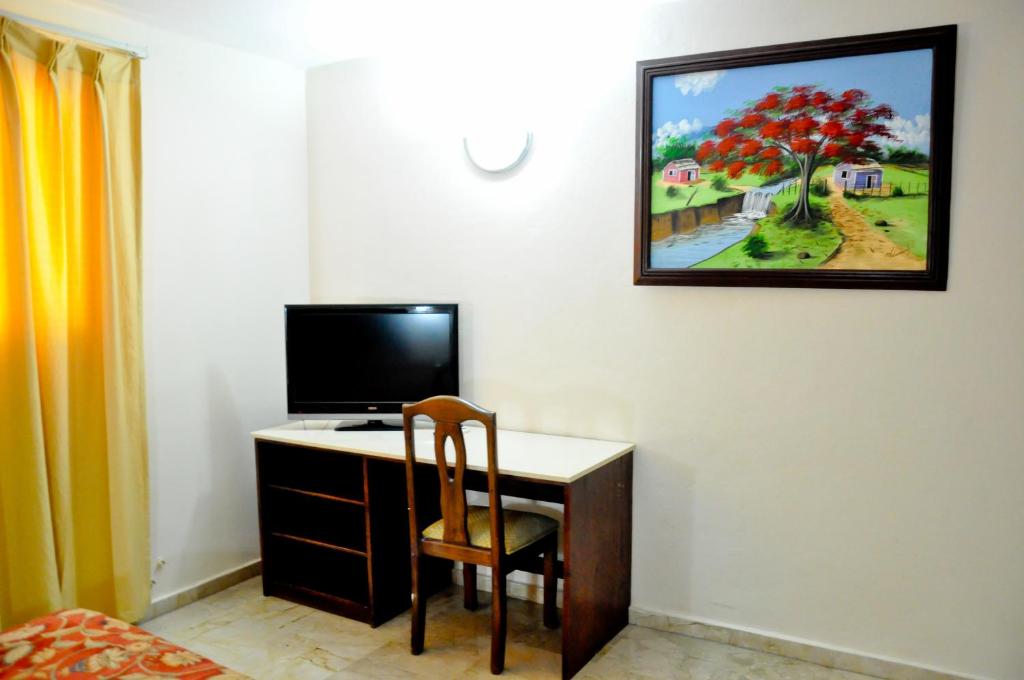 TV a/nebo společenská místnost v ubytování Hotel Marimba Punta Cana
