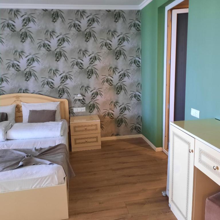 Postel nebo postele na pokoji v ubytování Kolkhida Resort & Spa