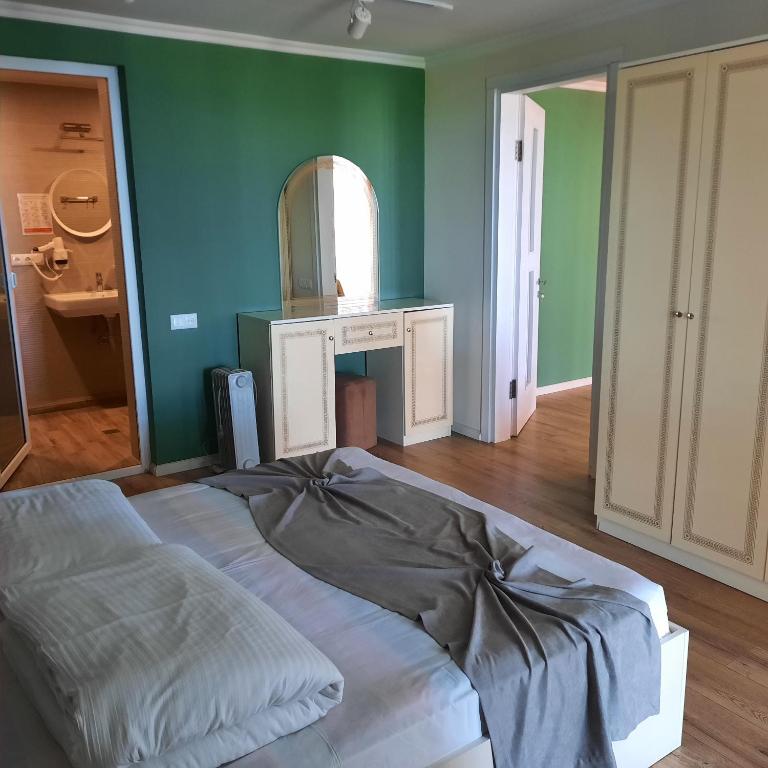 Postel nebo postele na pokoji v ubytování Kolkhida Resort & Spa