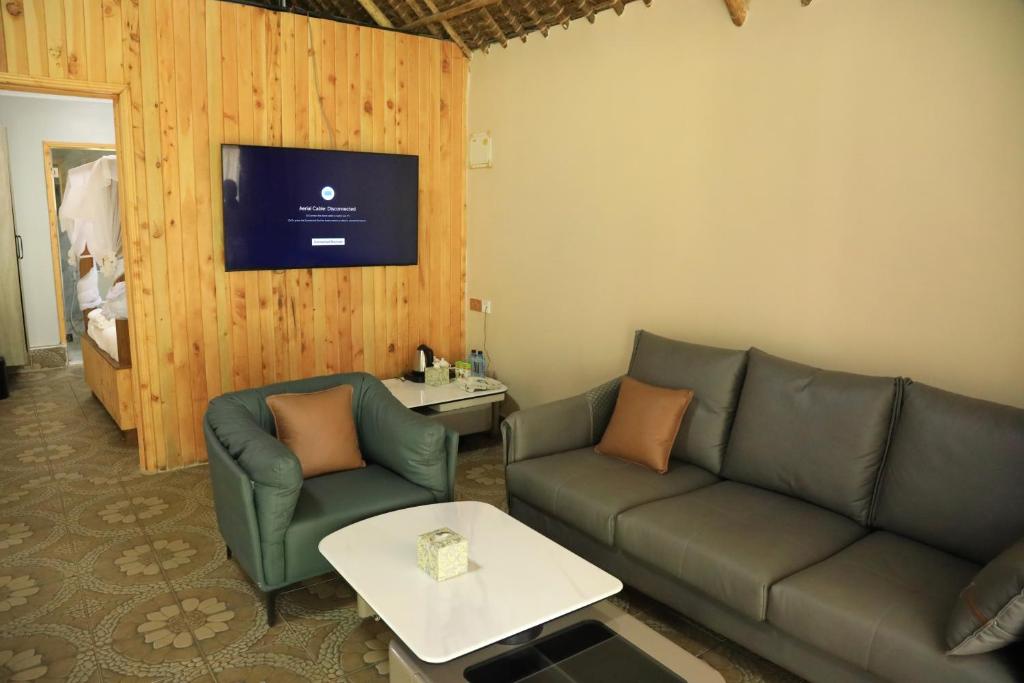 TV a/nebo společenská místnost v ubytování The Giraffe Cottages