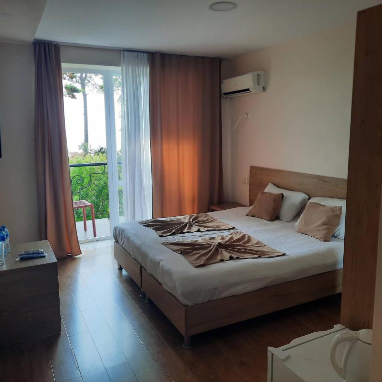 Postel nebo postele na pokoji v ubytování Kolkhida Resort & Spa