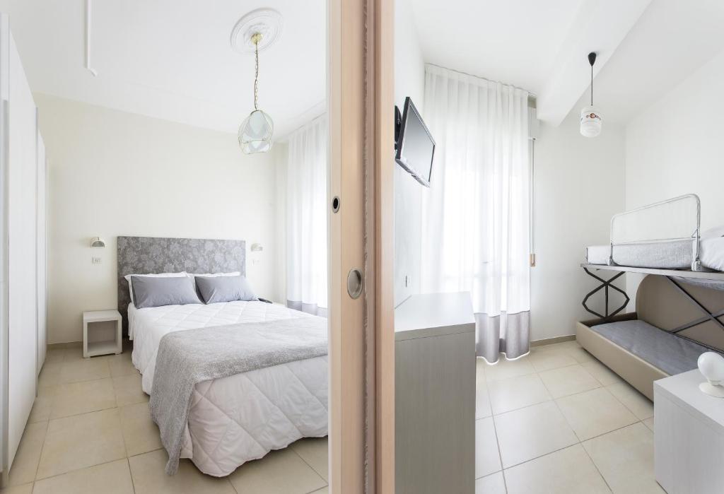 Postel nebo postele na pokoji v ubytování Hotel Caesar