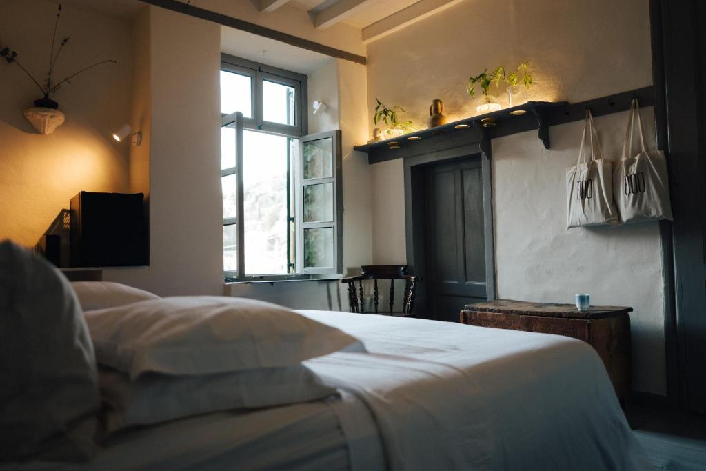 Postel nebo postele na pokoji v ubytování 1900 Hotel
