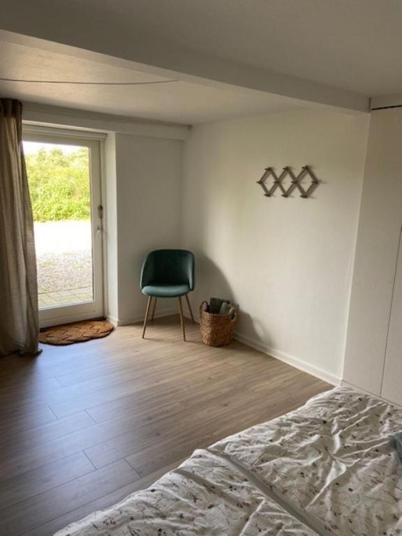 Postel nebo postele na pokoji v ubytování Overnatning Egsmark