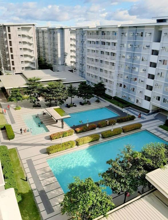 Bazén v ubytování 1BR at Trees Residences with Balcony nebo v jeho okolí
