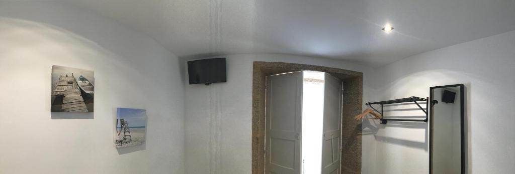 TV a/nebo společenská místnost v ubytování Pensión Residencia Fonseca