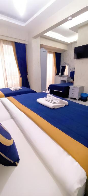 Postel nebo postele na pokoji v ubytování BALPETEK HOTEL