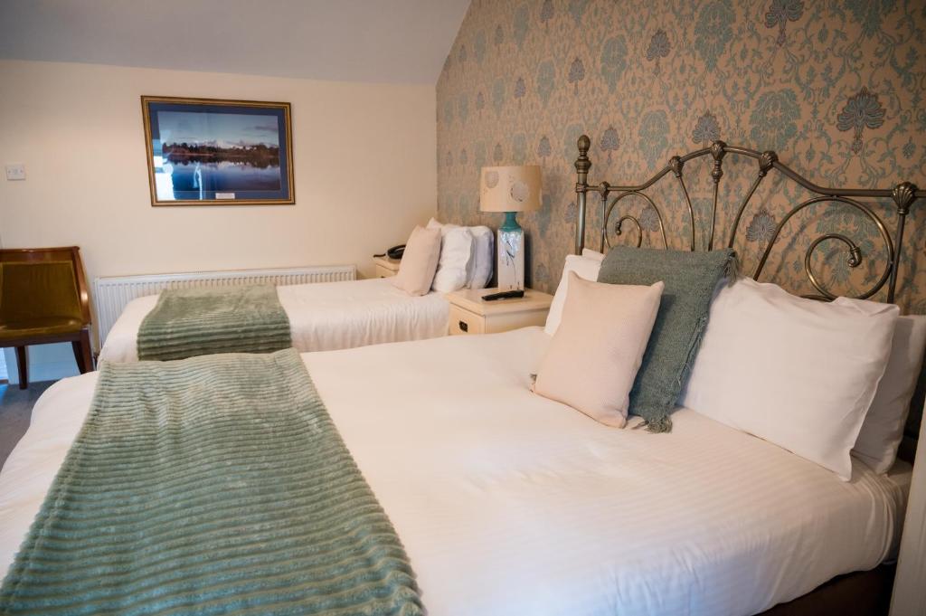 Postel nebo postele na pokoji v ubytování Carrygerry Country House