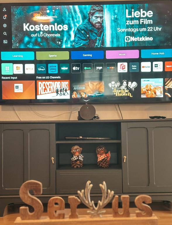 TV a/nebo společenská místnost v ubytování Panorama-Refugium