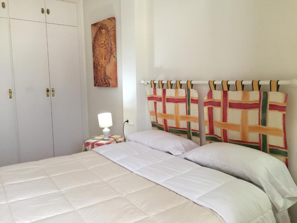 Postel nebo postele na pokoji v ubytování Apartamento Rosendo
