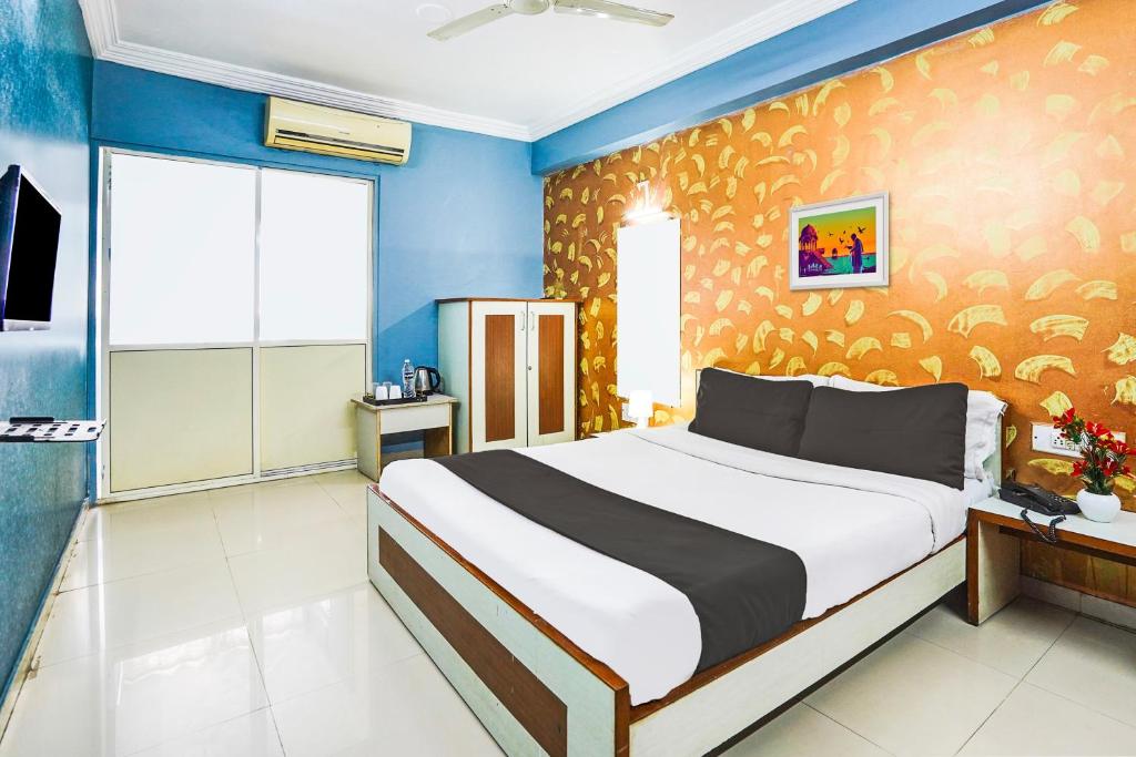 Postel nebo postele na pokoji v ubytování Super Hotel O Vibrant Residency