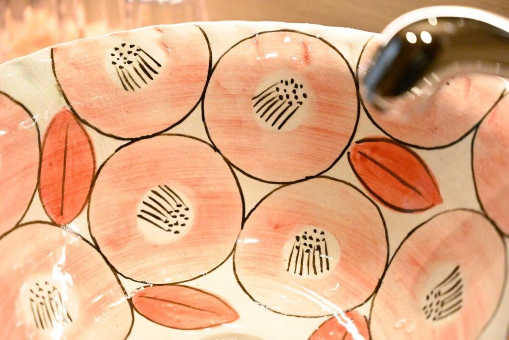 a close up of a vase with somembermbermbermbermber at Manabi-stay Matsue 駅近伊勢宮町どこに行くにも最高に便利な古民家一棟貸切ホテル in Matsue